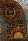 The “Gosshveymashina” logo, the coat of arms of the USSR, rising sun and the Soviet beams under factory pipes. A fragment the picture \"Stop “Ryazan Patterns” from the “Province” series, 2015-16.