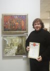Alexey Akindinov at the pictures, with the diploma handed to him. Opening of the anniversary Regional art exhibition \"Fall — 2015\" devoted to the 75 anniversary of the Ryazan organization of the Union of artists of Russia. 