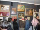 Viewers of the paintings by Alexey Akindinov. Club shop \"Tin\". 26 October 2012.