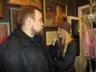 Poet - Alex Kolchev and artist - Olga Samokhvalova against Alexey Akindinov paintings. 