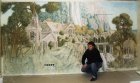Alexey Akindinov against the wall painting \"Elven city.\" 1st wall. 
