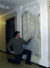 Alexey Akindinov against the wall painting \"Prague number 2\", December 2012.