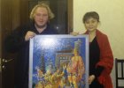 The director of the Beijing art gallery is madam Ming Li and Alexey Akindinov with the picture \"Alerika-Gerika\". September 5, 2017. Moscow.