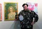 Alexei Akindinov at his painting \"Rose Fairy\" with the award of the winner of the festival - Diploma of II degree. International exhibition-competition \"World of Esotericism\", gallery \"Art-Commune\", Moscow, st. Kyiv, 2. April 22, 2023.