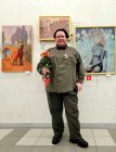 Alexey Akindinov near his paintings at the opening of his personal exhibition \"Ornamental Reality\". Art Gallery \"Prio-Vneshtorgbank\", Ryazan.