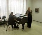Musical performance: Marina Ovodkova (vocal), Evgeny Antipov (grand piano). At opening of the Spring 2015 exhibition devoted to the 70 anniversary of the Victory over fascism. Showroom of the Union of artists of Russia, Ryazan. April 23. Russia.