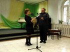 The director of \"The historical and art museum\" Anastasia Scherbakova hands to Alexey Akindinov the Certificate of honor \"For the organization of the Patterns exhibition. 