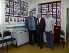 At the left – to the right: Alexey Akindinov, the director of Zakharovsky museum of local lore – Anatoly Mirionkov, the artist - Andrey Mironov at the exposition devoted to heroes veterans. 
